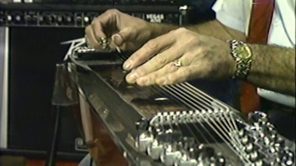 Jeff Newman's hands playing the steel guitar